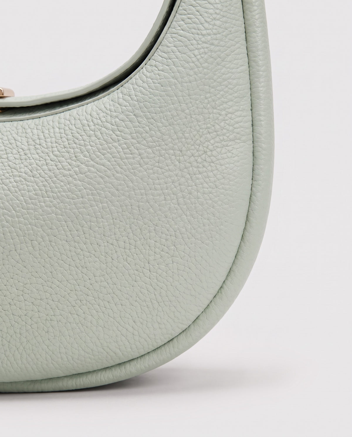 Close-up of the pebbled cowhide leather on the Todi bag in Mint