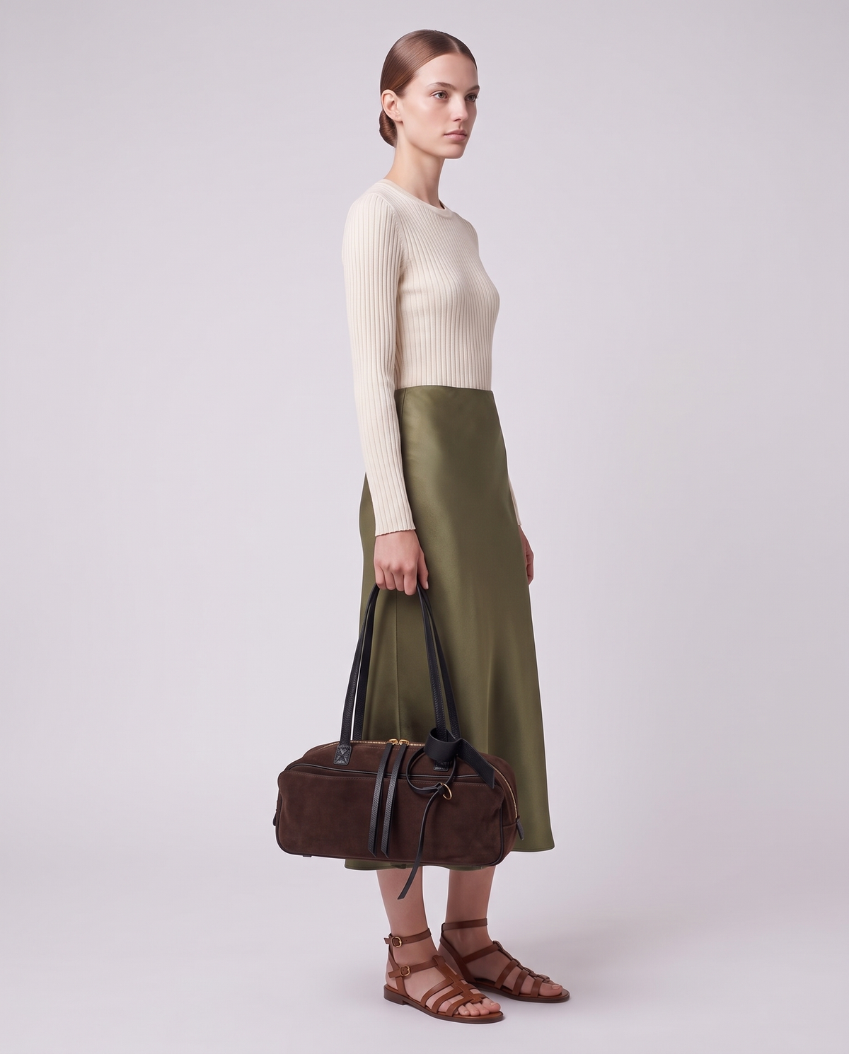 Model carrying the Valentina Umbra Large bag in Chocolate