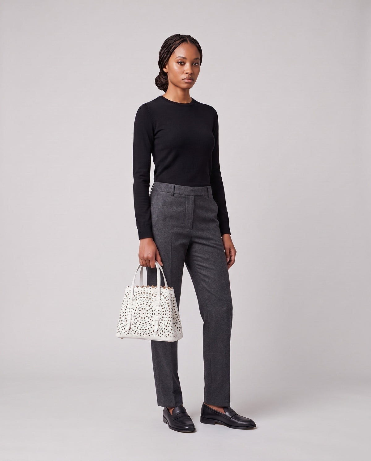 Model holding the Valentina Urbino Large bag in White, full length