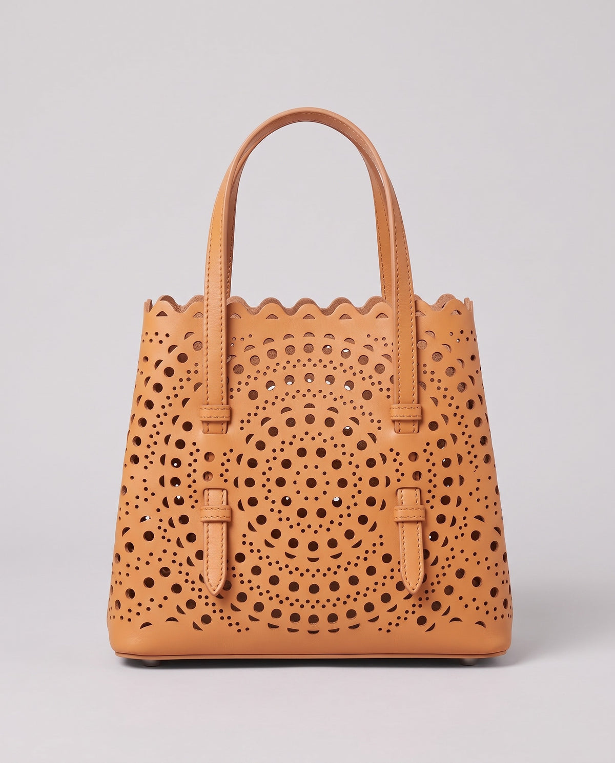 Hardware and handle detail on the Valentina Urbino Small bag in Apricot