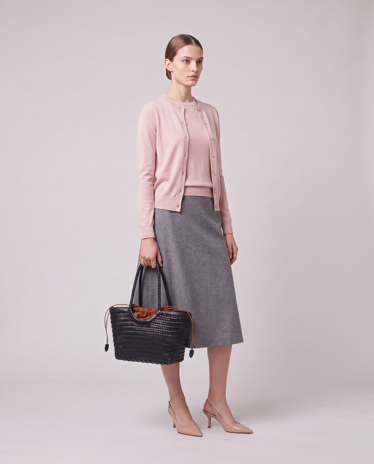 Model holding the Valentina Bosa bag in Black, full length