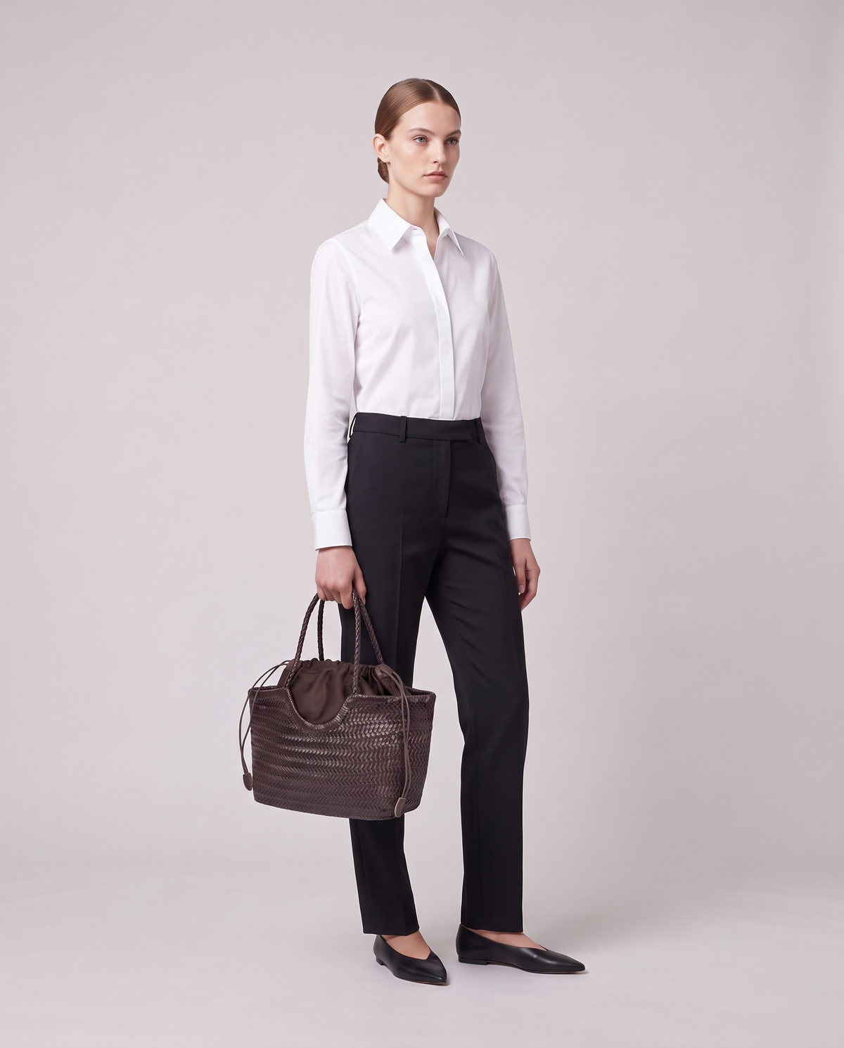 Model holding the Valentina Gubbio bag in Chocolate, full length