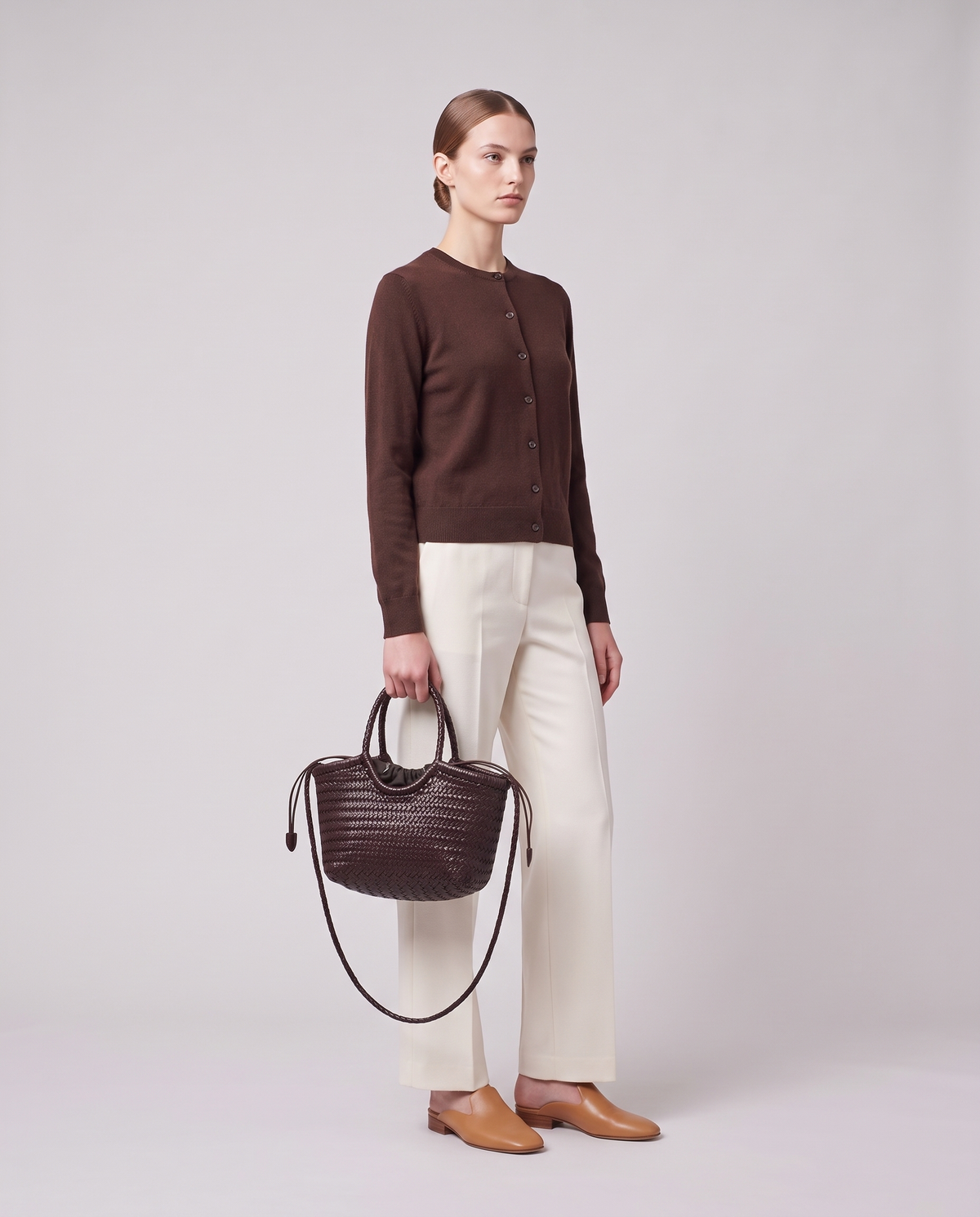 Model carrying the Valentina Lecce bag in Chocolate