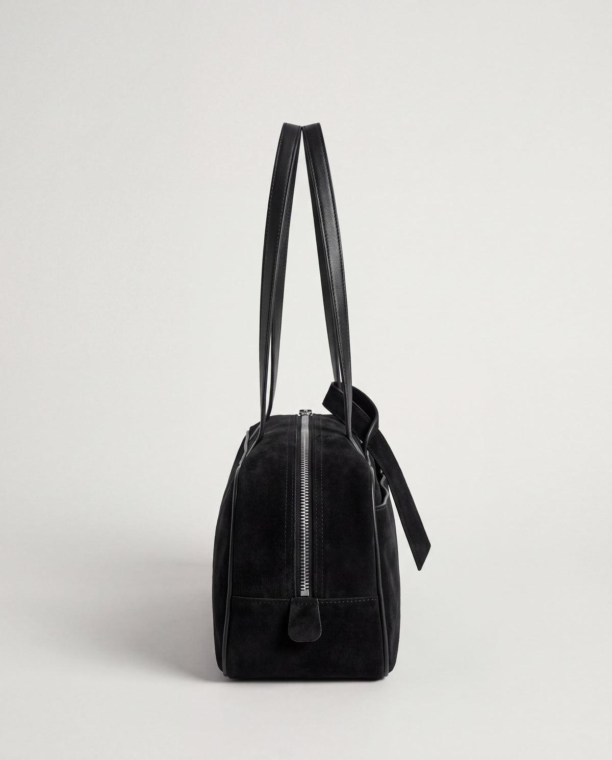 Valentina Linea suede shoulder bag in Black, side view showing the end zip