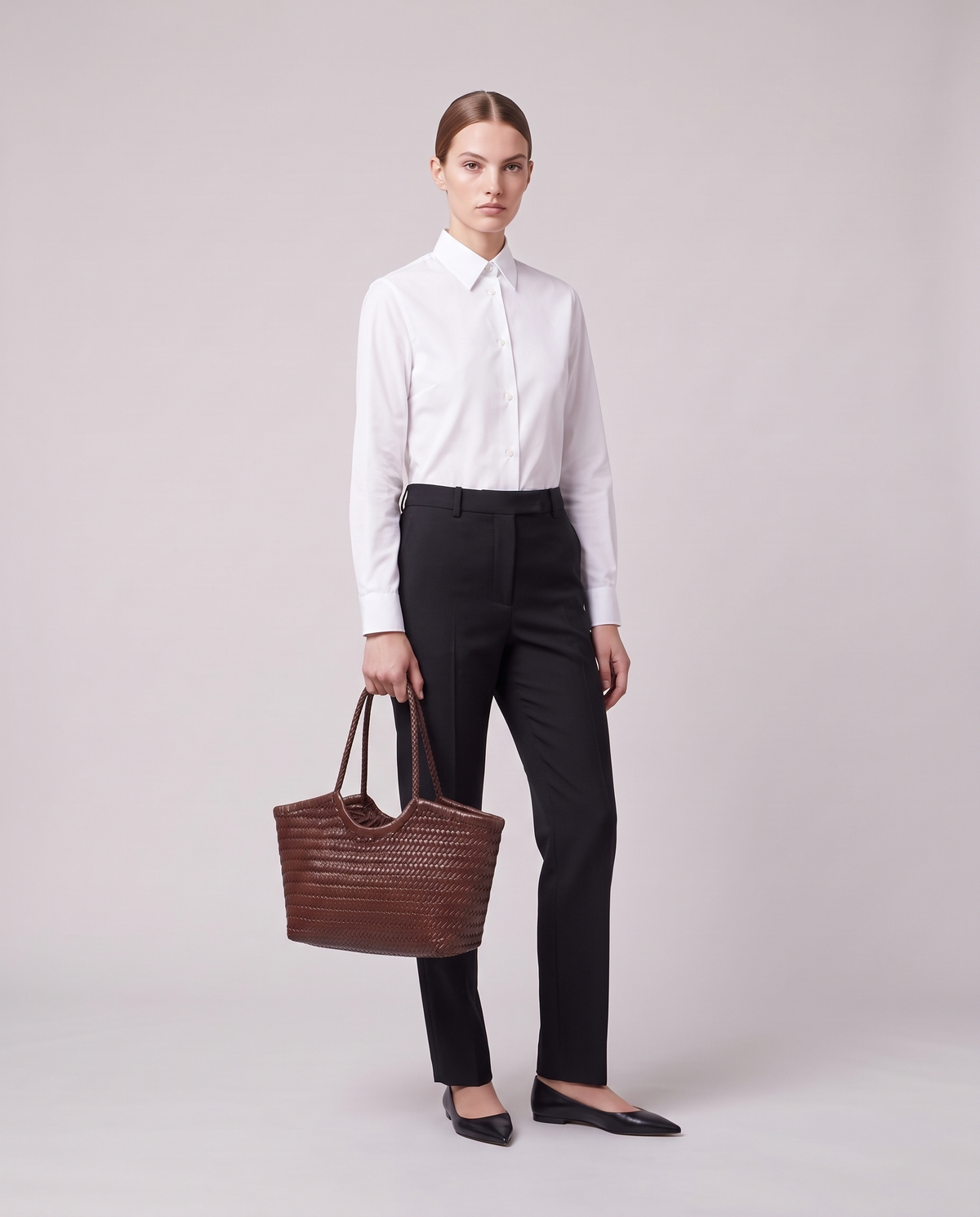 Model holding the Valentina Matera Large bag in Chocolate, full length
