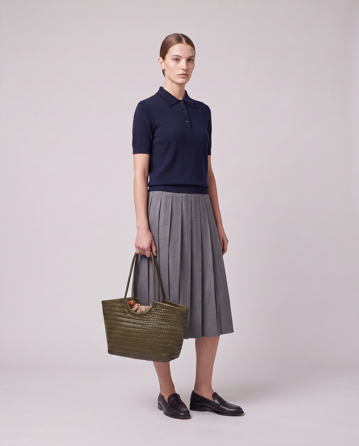 Model holding the Valentina Matera Small bag in Olive, full length