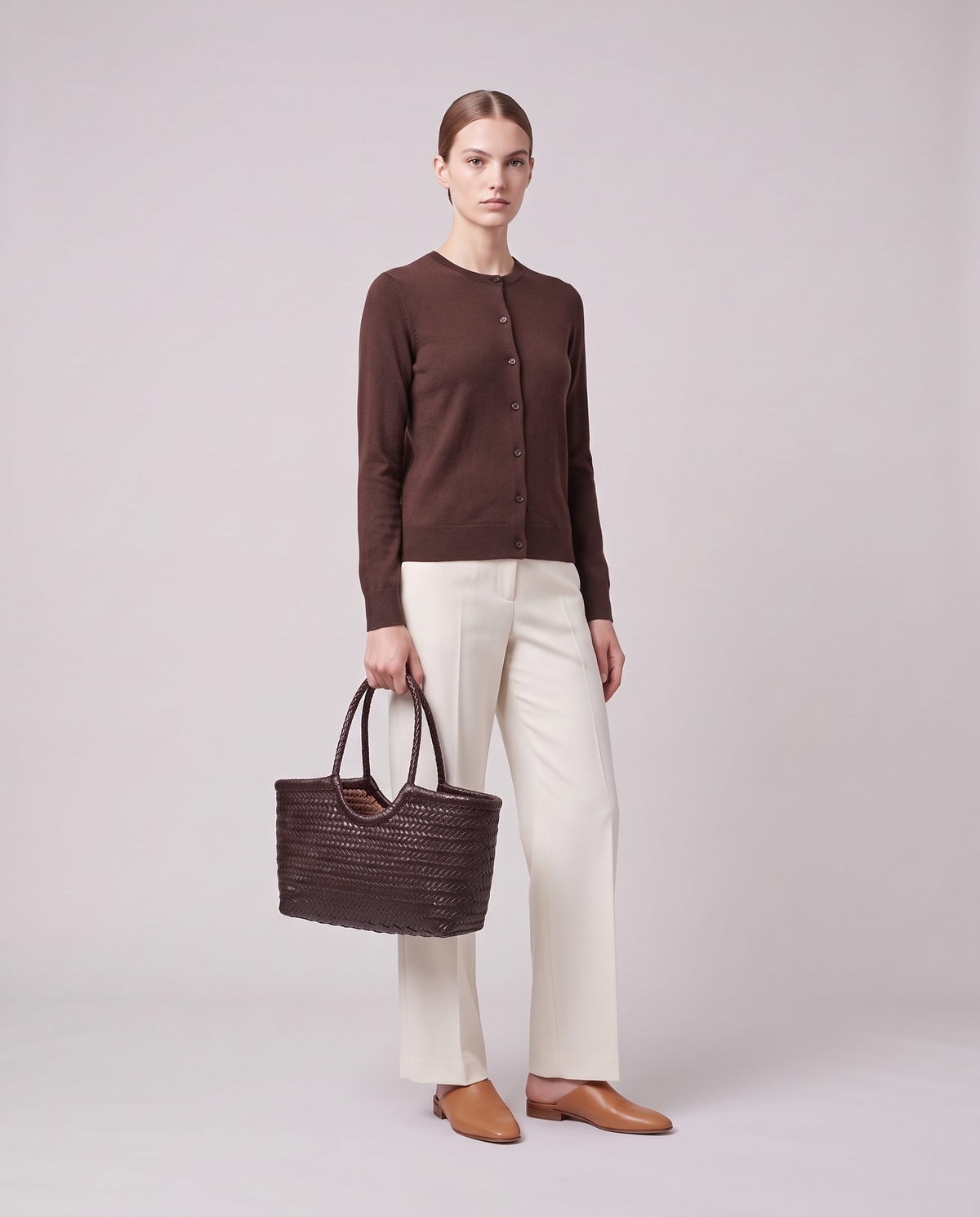Model holding the Valentina Noto Large bag in Chocolate, full length