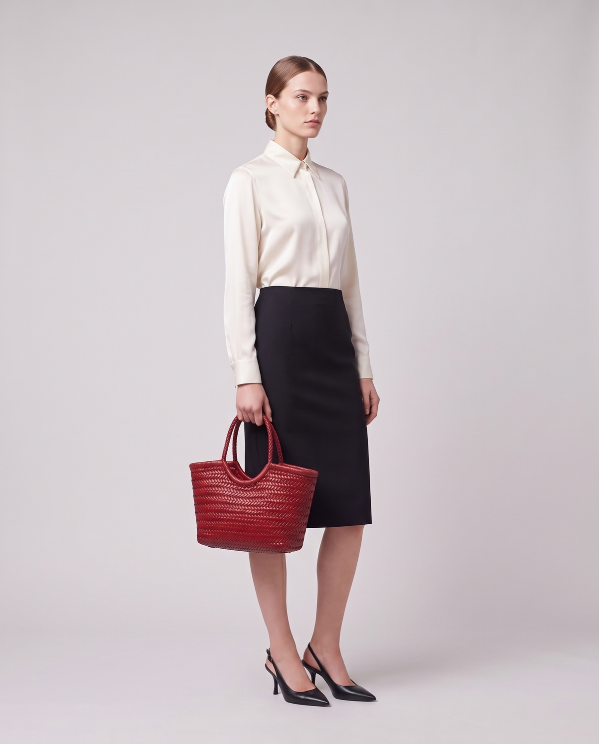 Model carrying the Valentina Noto Large bag in Red