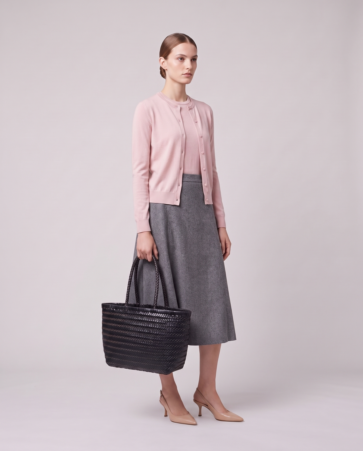 Model holding the Valentina Noto Small bag in Onyx, full length