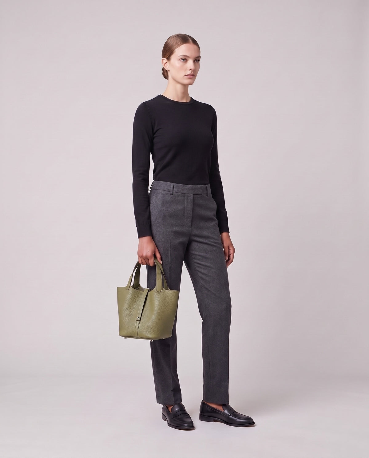 Model holding the Valentina Ostuni Large bag in Sage, full length