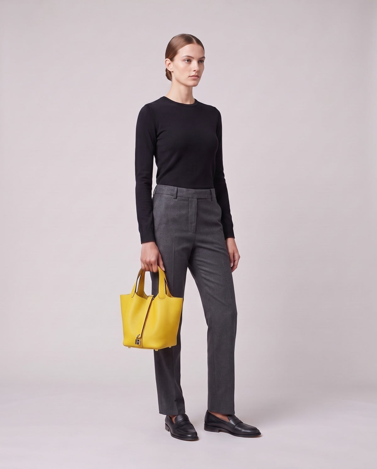 Model holding the Valentina Ostuni Large bag in Yellow, full length
