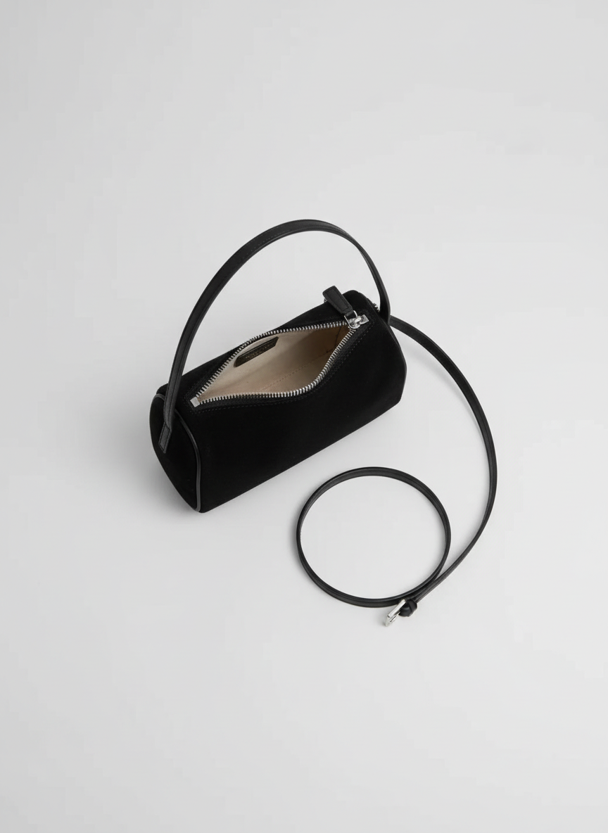 Valentina Roma barrel bag in black suede, open from above showing the interior
