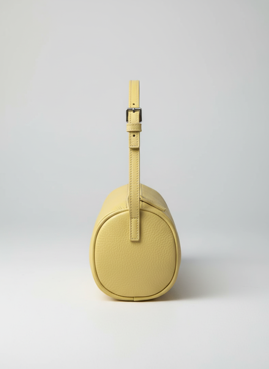 Valentina Roma barrel bag in pale yellow leather, side view