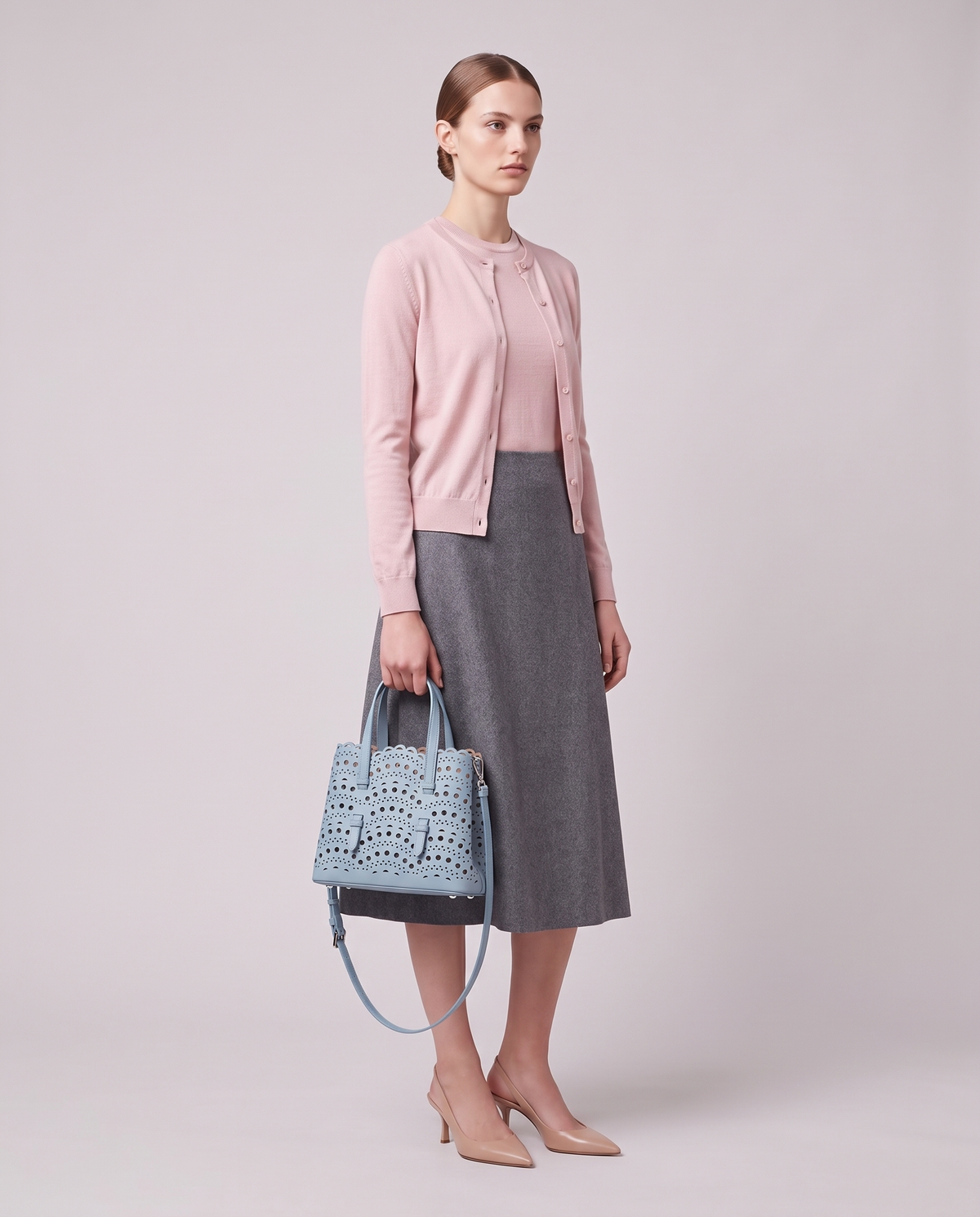 Model carrying the Valentina Urbino Large bag in Sky