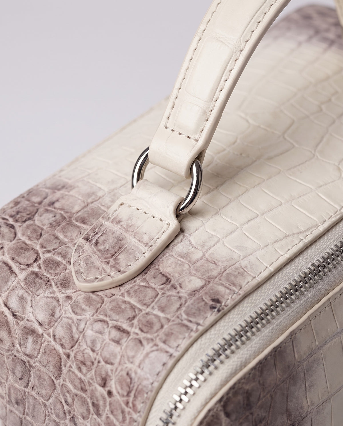 Varenna Large croc-embossed vanity case in Pearl – close-up of the leather and stitching