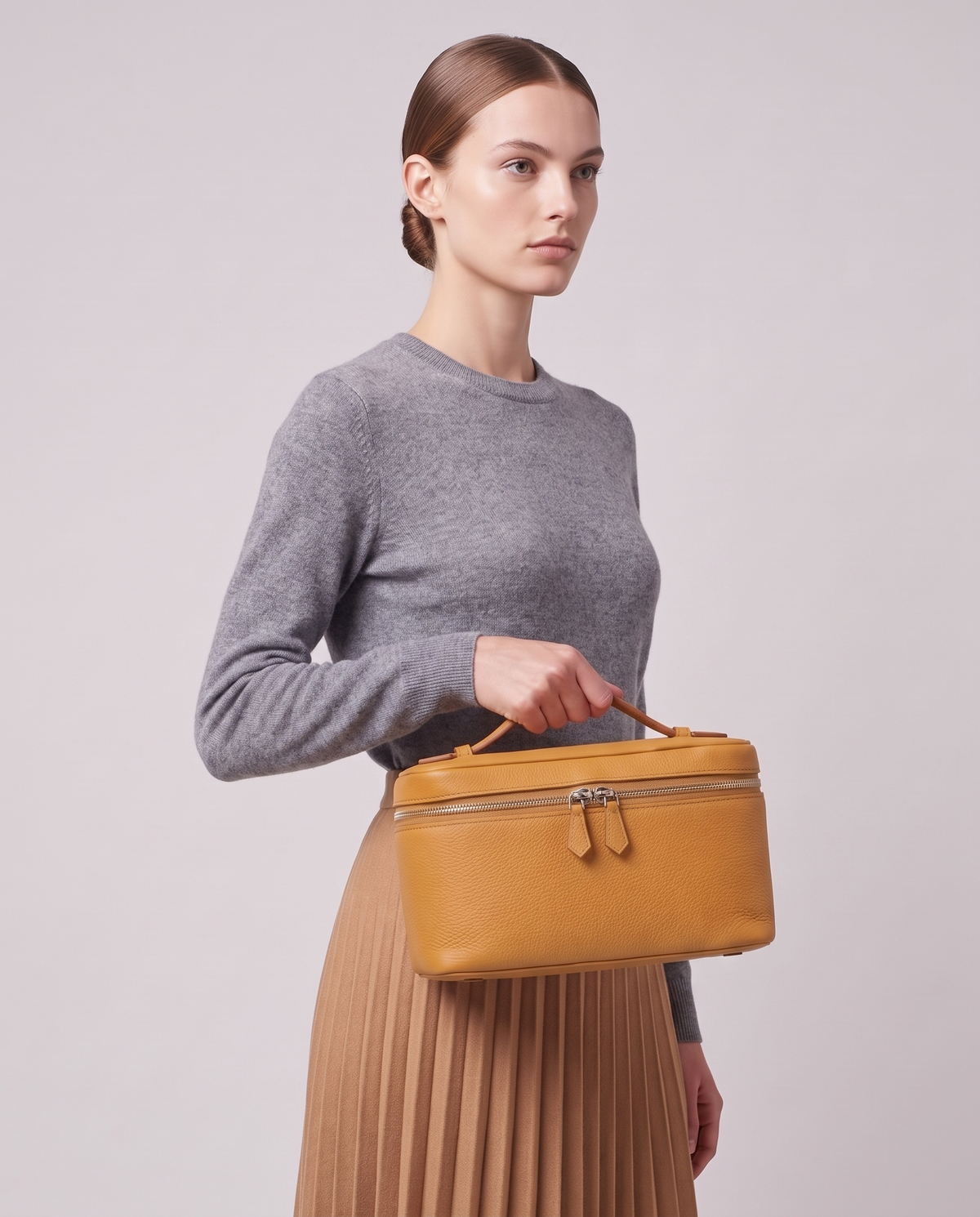 Model holding the VaValentina Orvieto Small top-handle bag in Ivory leather, three-quarter viewlentina Orvieto Small top-handle bag in Ivory leather, full length