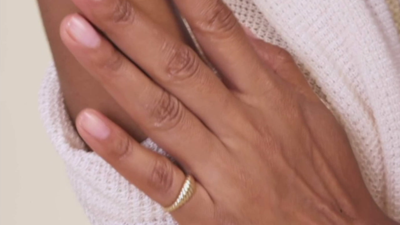 A model wearing Croissant shaped ring in gold color