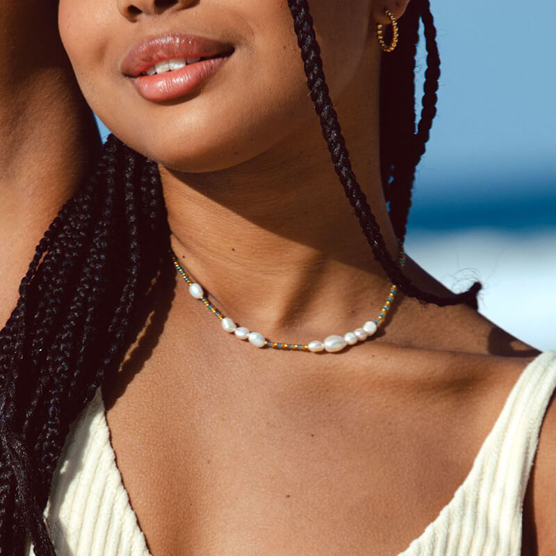 Model wearing freshwater pearl necklaces