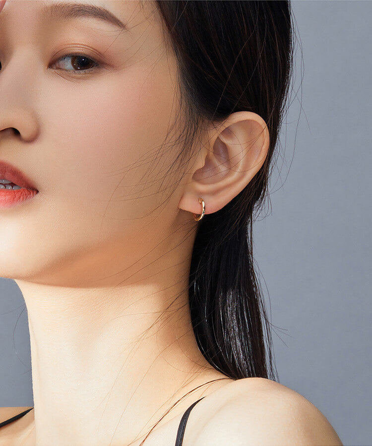 Model wearing Minimalist Hoop Earrings Gold