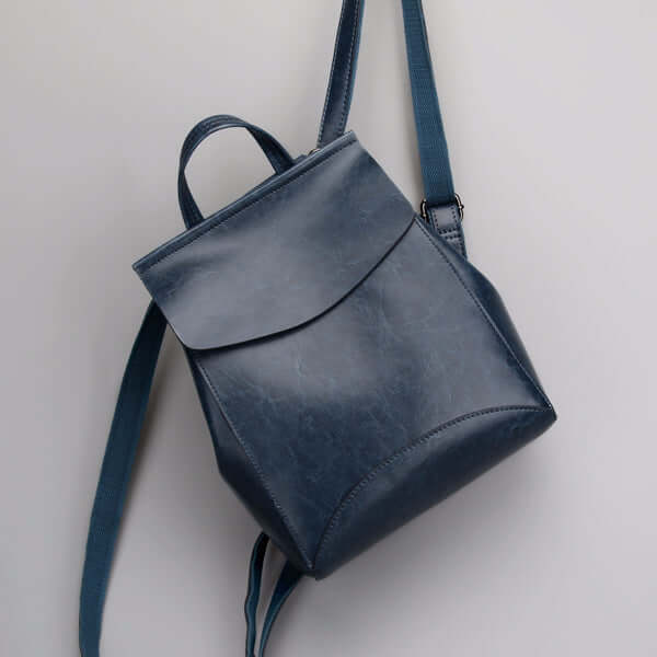 A blue leather backpack