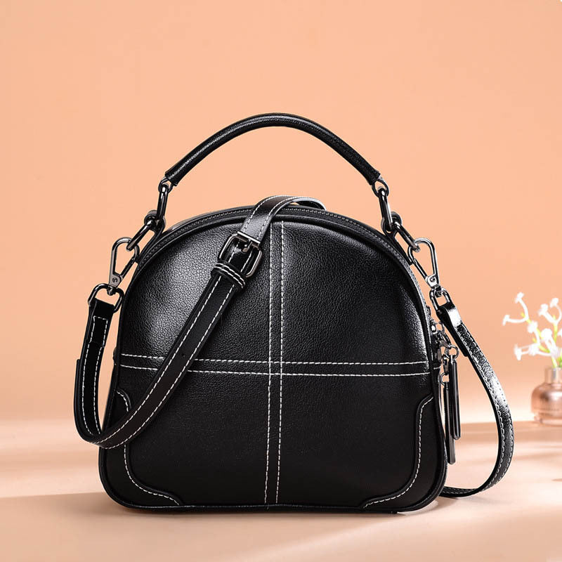 Black round leather bag