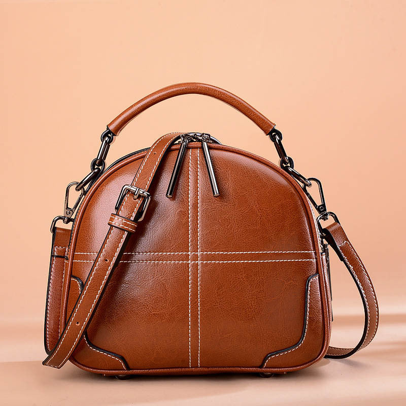 Brown round leather bag