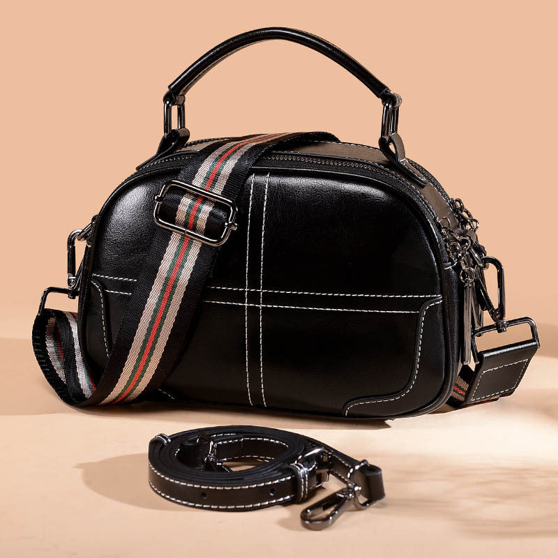 Black round leather bag