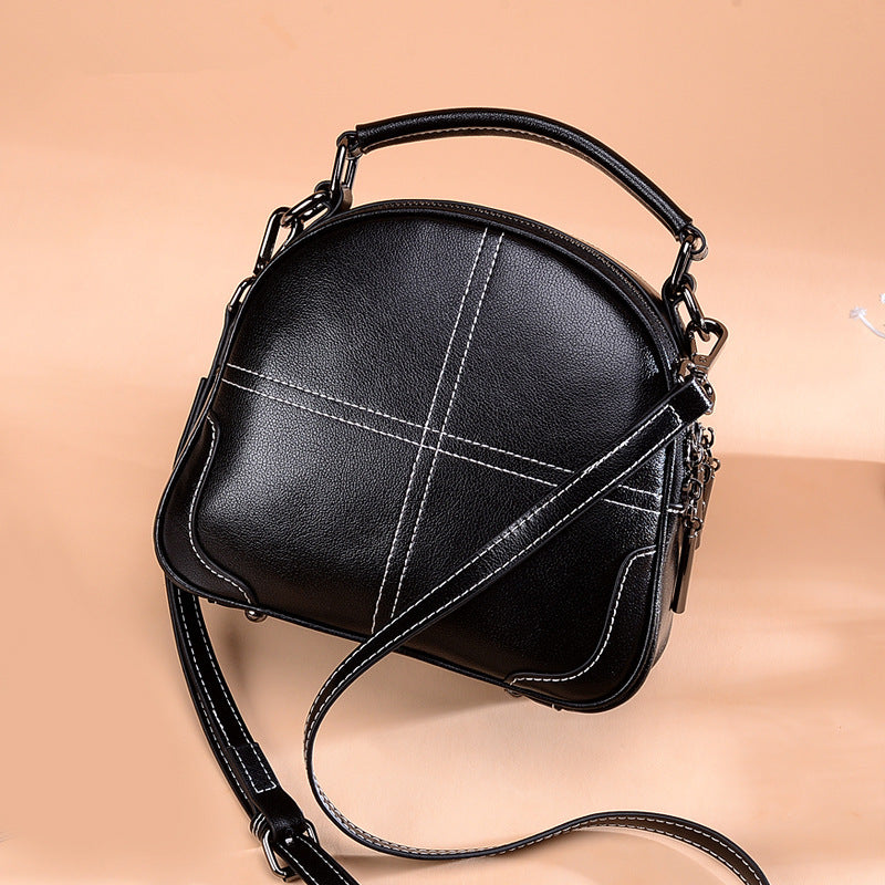 Black round leather bag