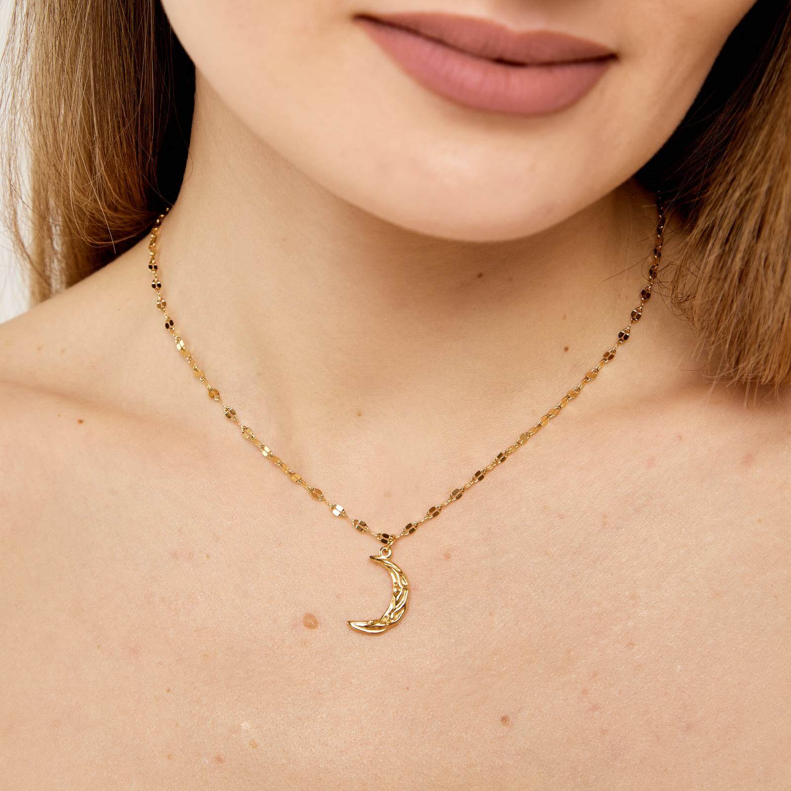 Model wearing 18k gold Hammered Crescent Necklace