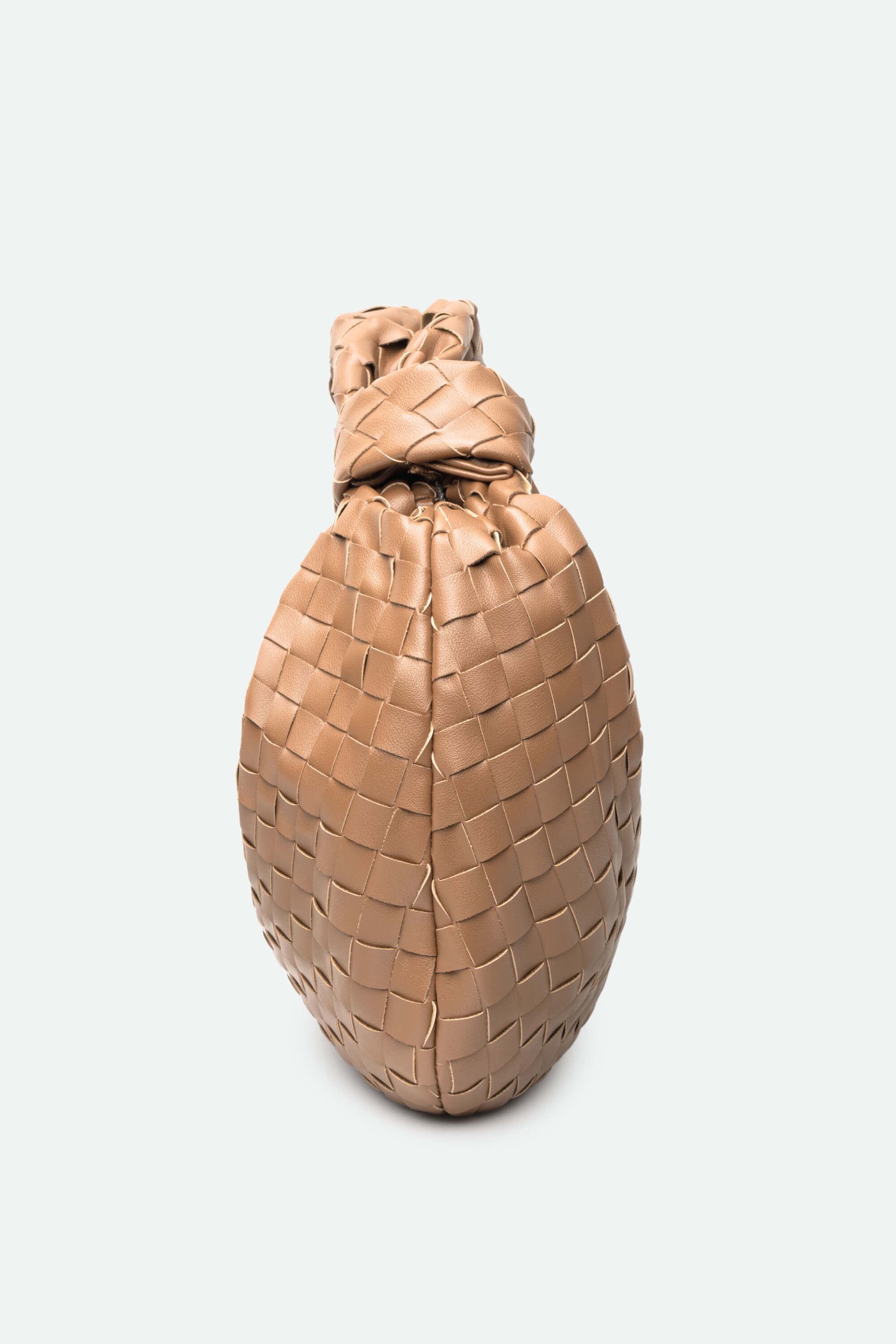 Beige woven handbag on a light gray background