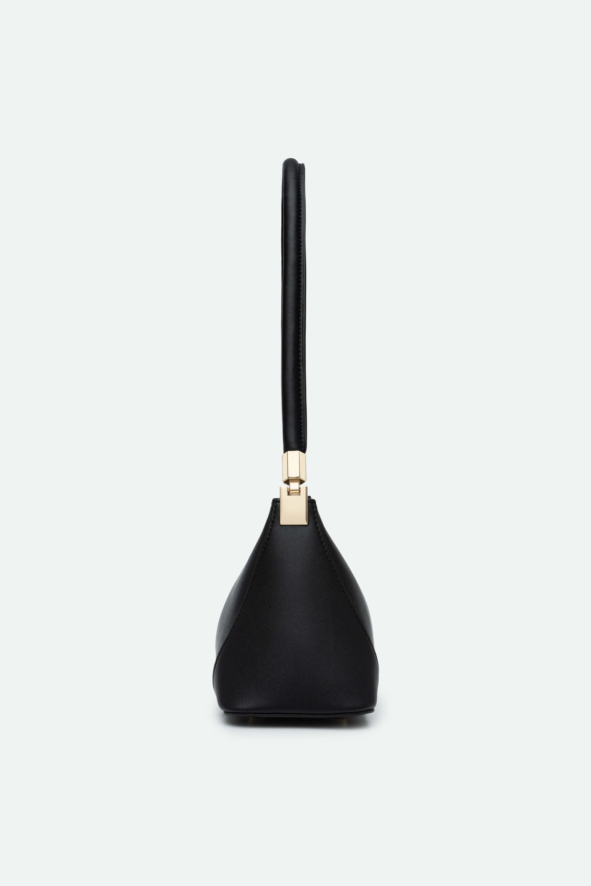 Black handbag with a gold accent on a white background