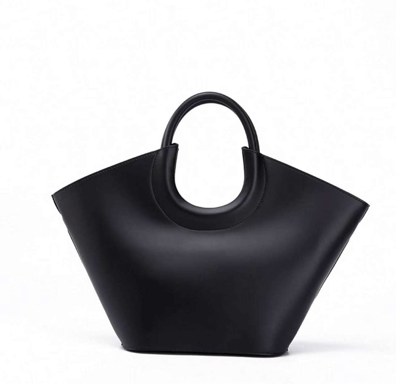 Black handbag with a unique design on a white background