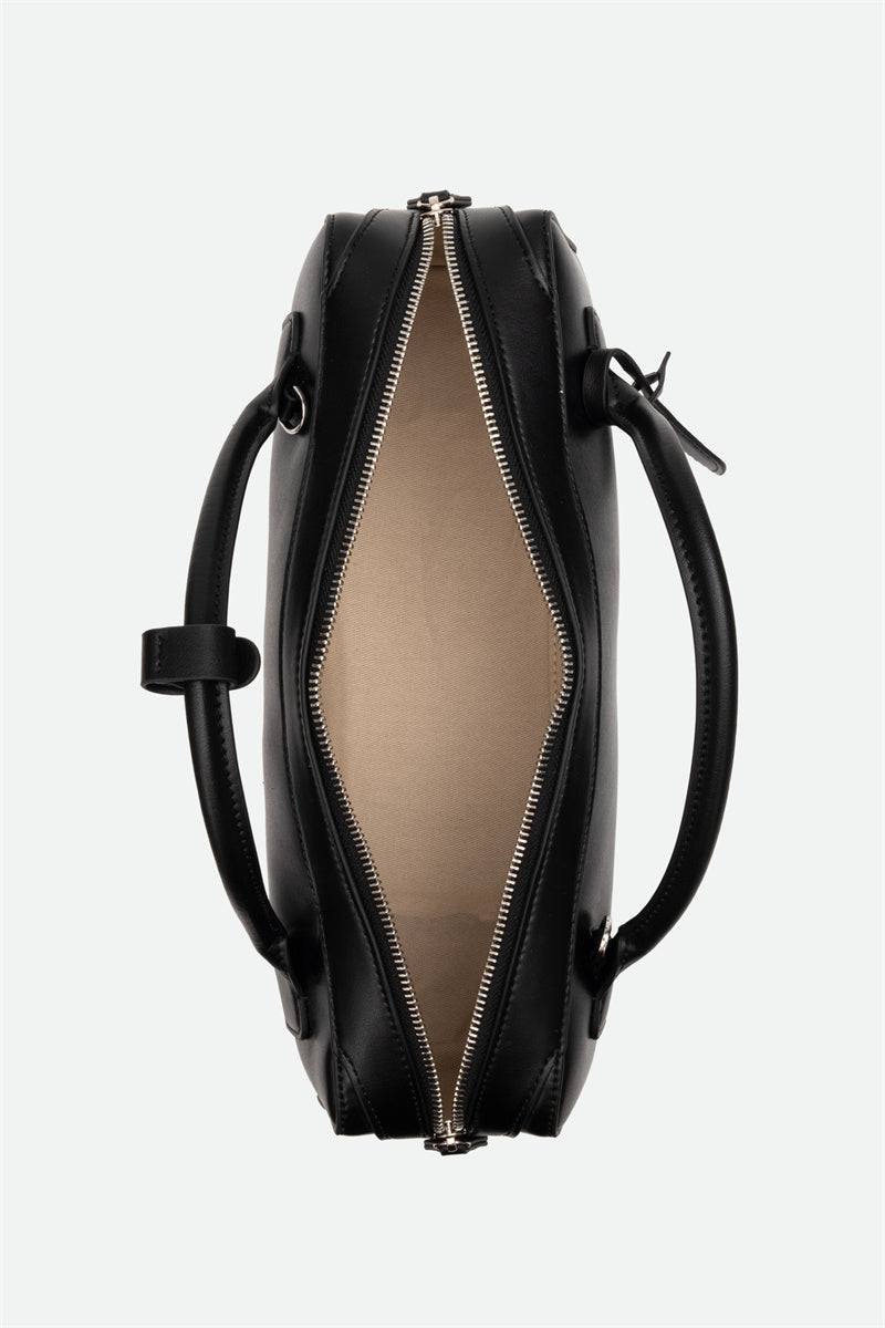 Black leather handbag with a zipper on a white background