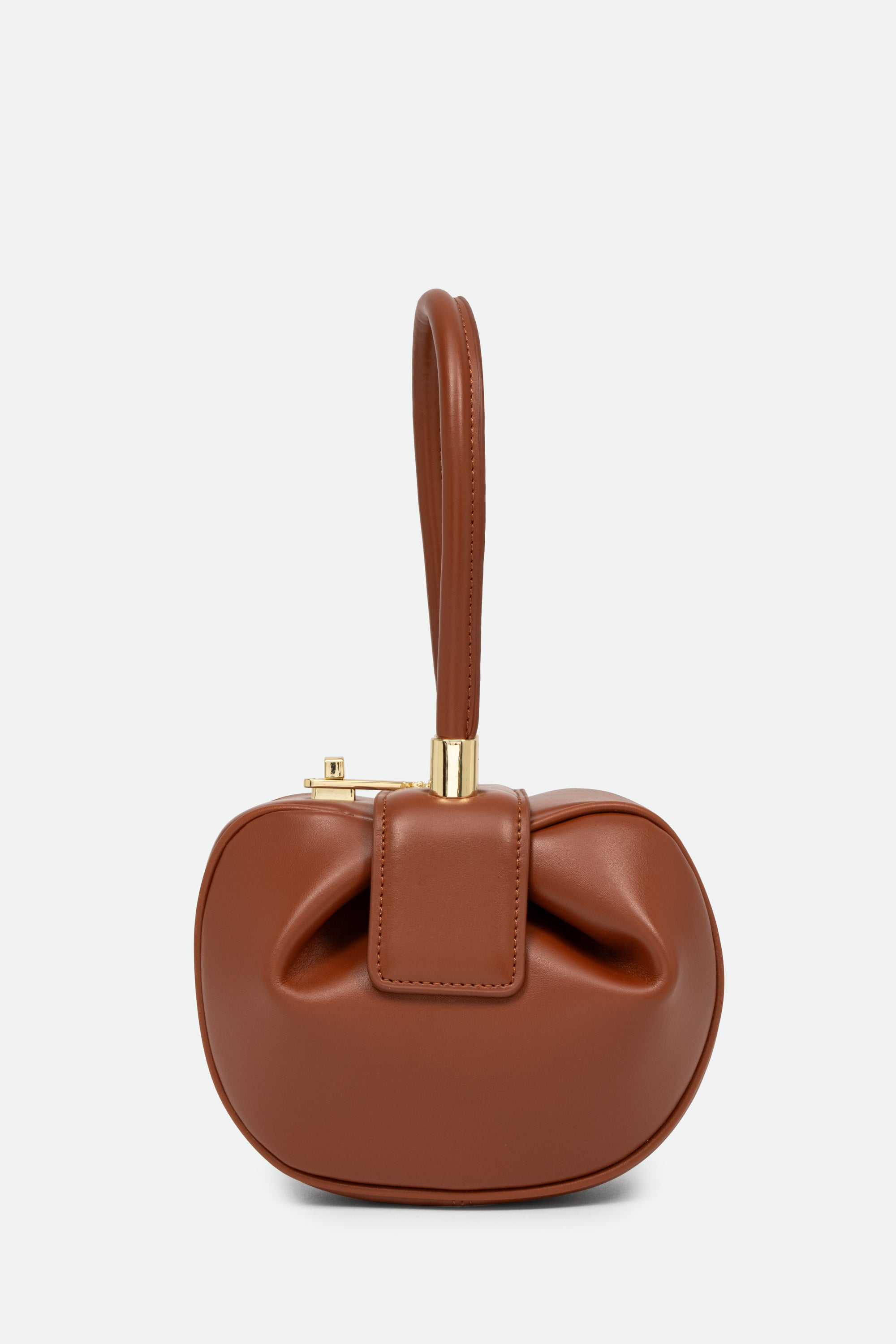 Brown handbag with a bow detail on a light gray background