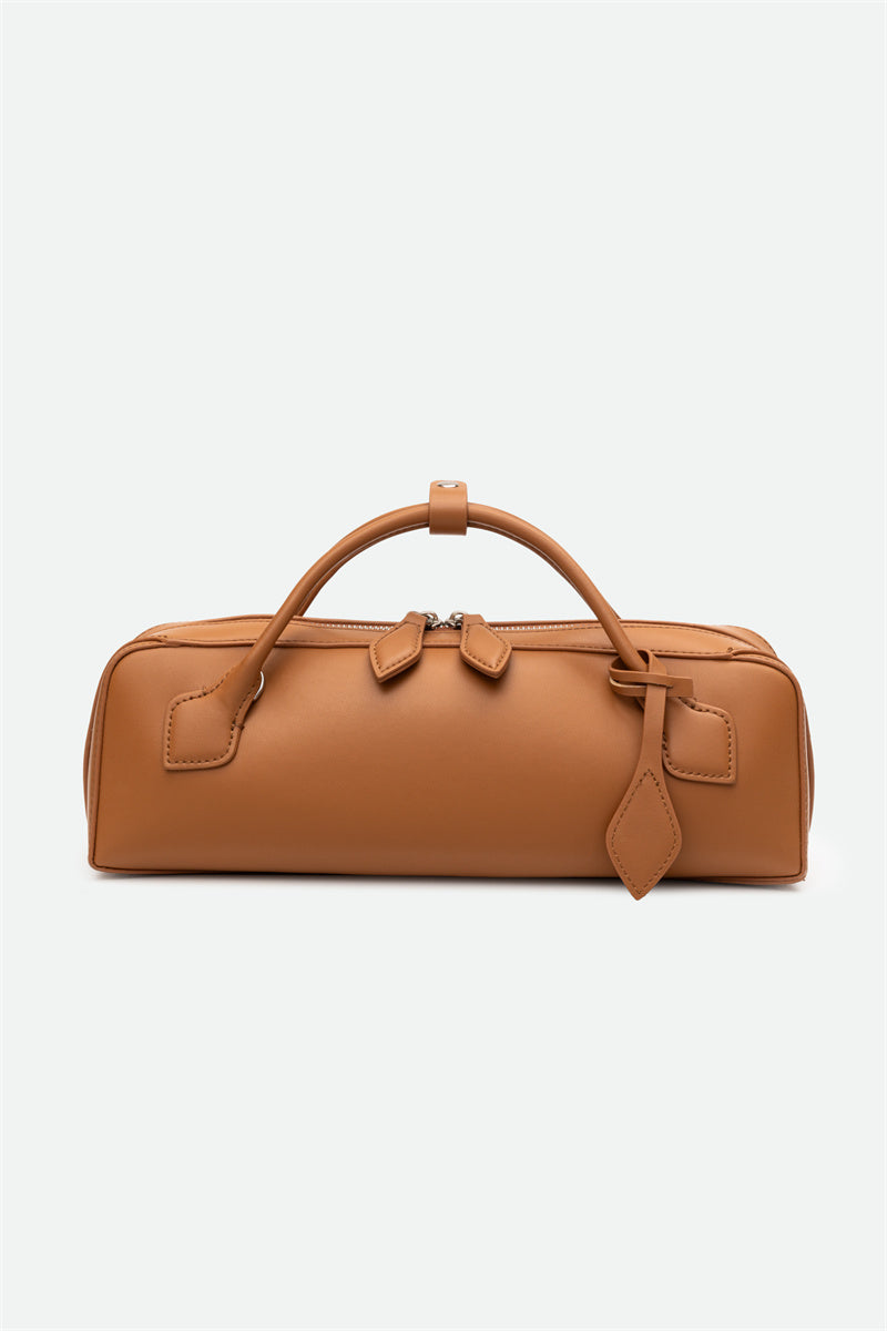 Brown leather bag on a white background