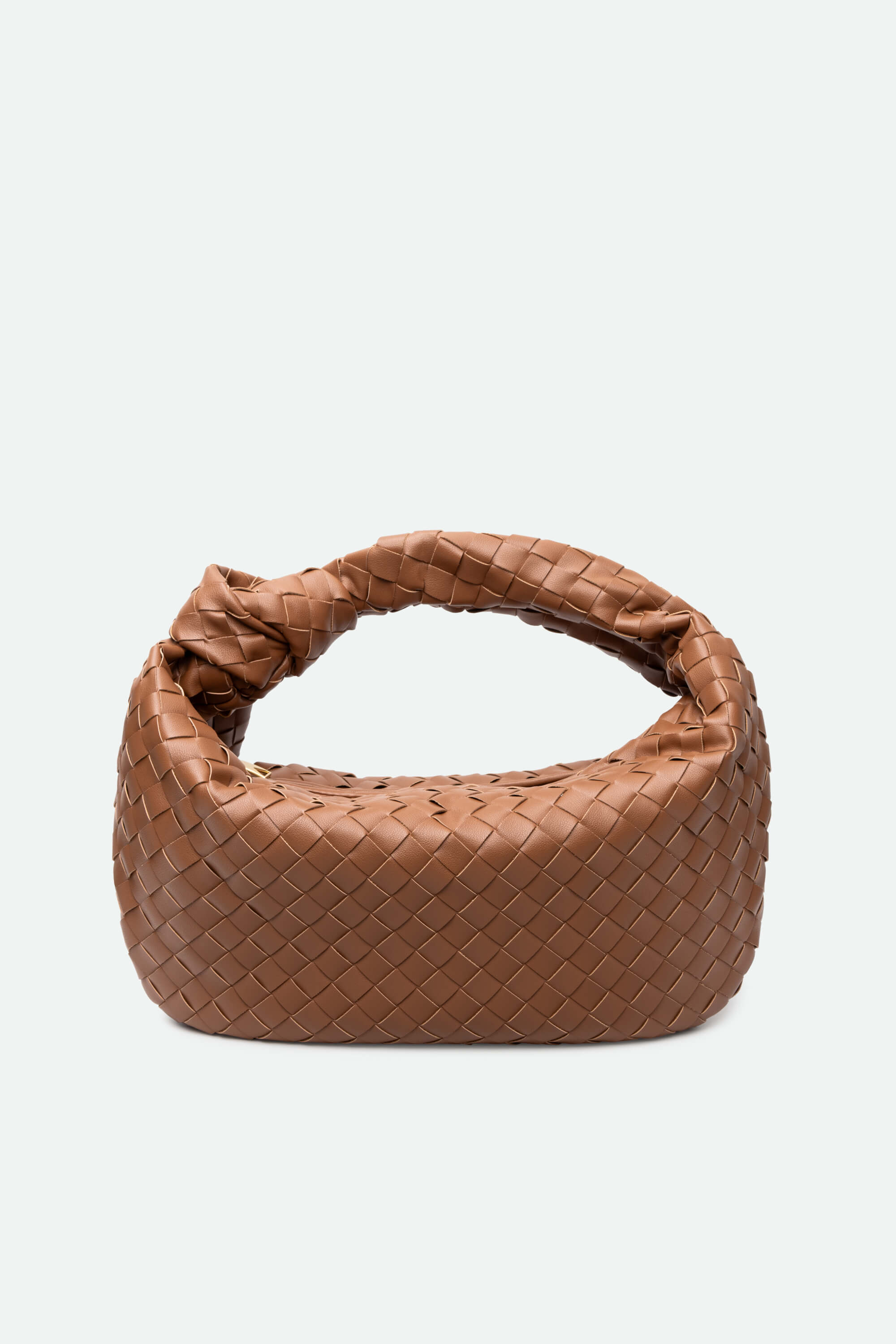 Brown woven handbag on a white background