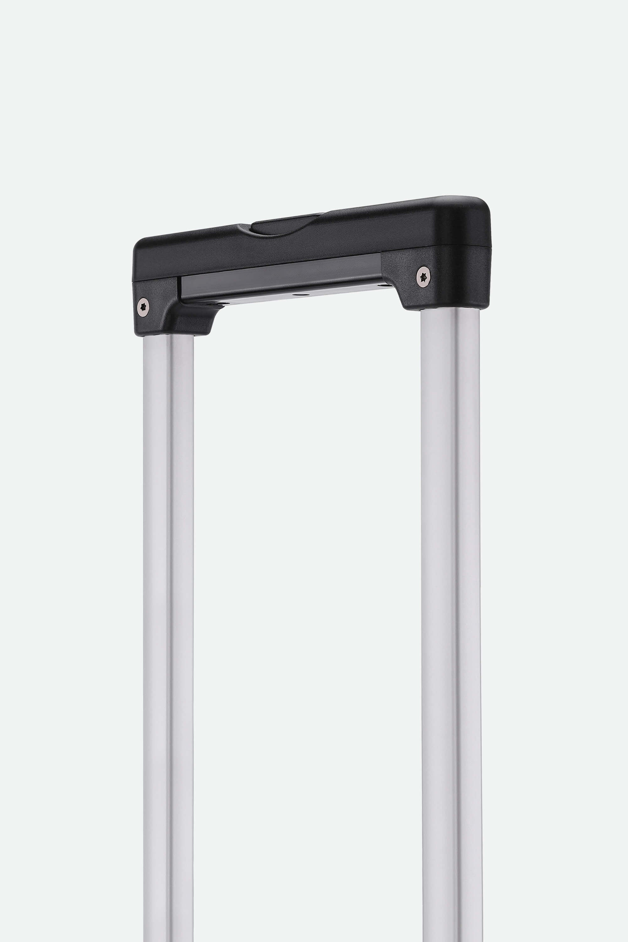 Close-up of a suitcase handle on a light gray background
