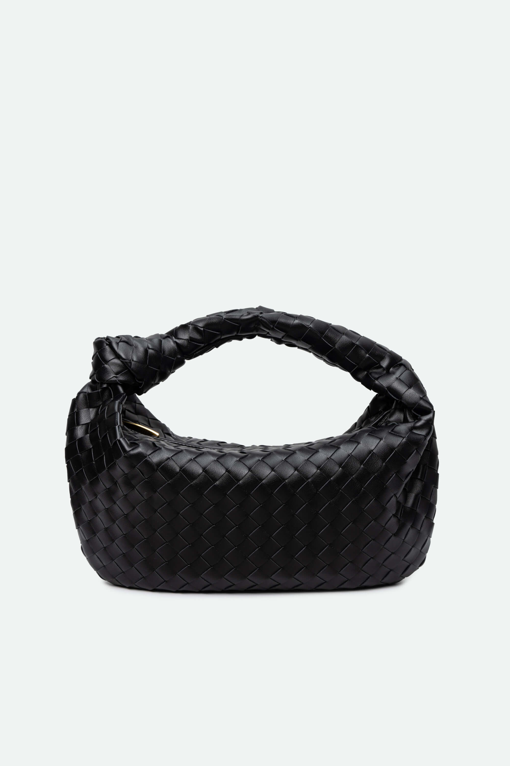 Black quilted handbag on a light gray background