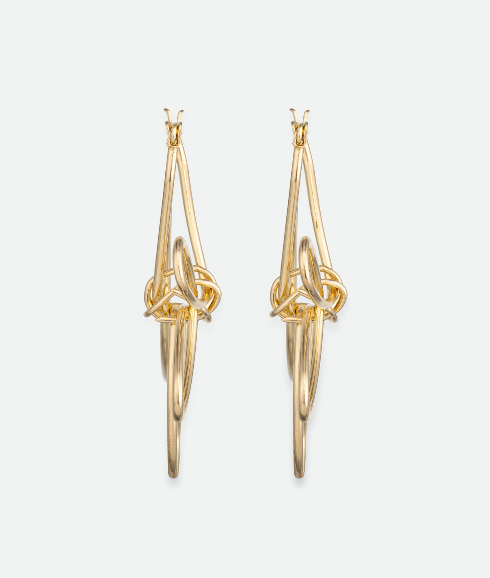 sideview of 18k gold flower earrings