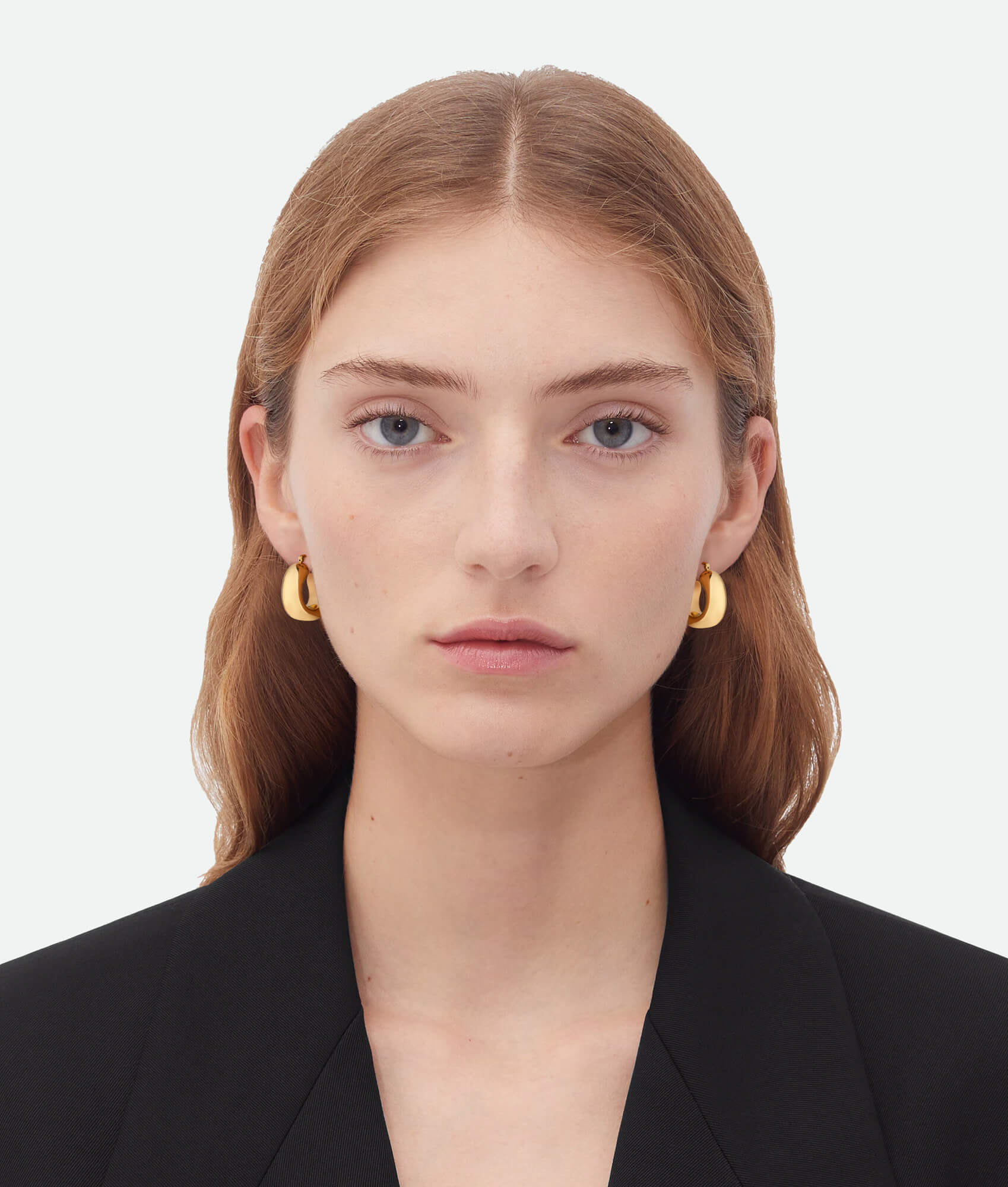 Model wearing  Chunky Gold Hoop Earrings