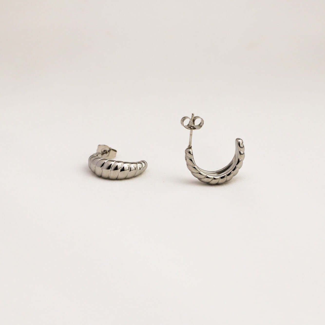 A pair of silver earrings