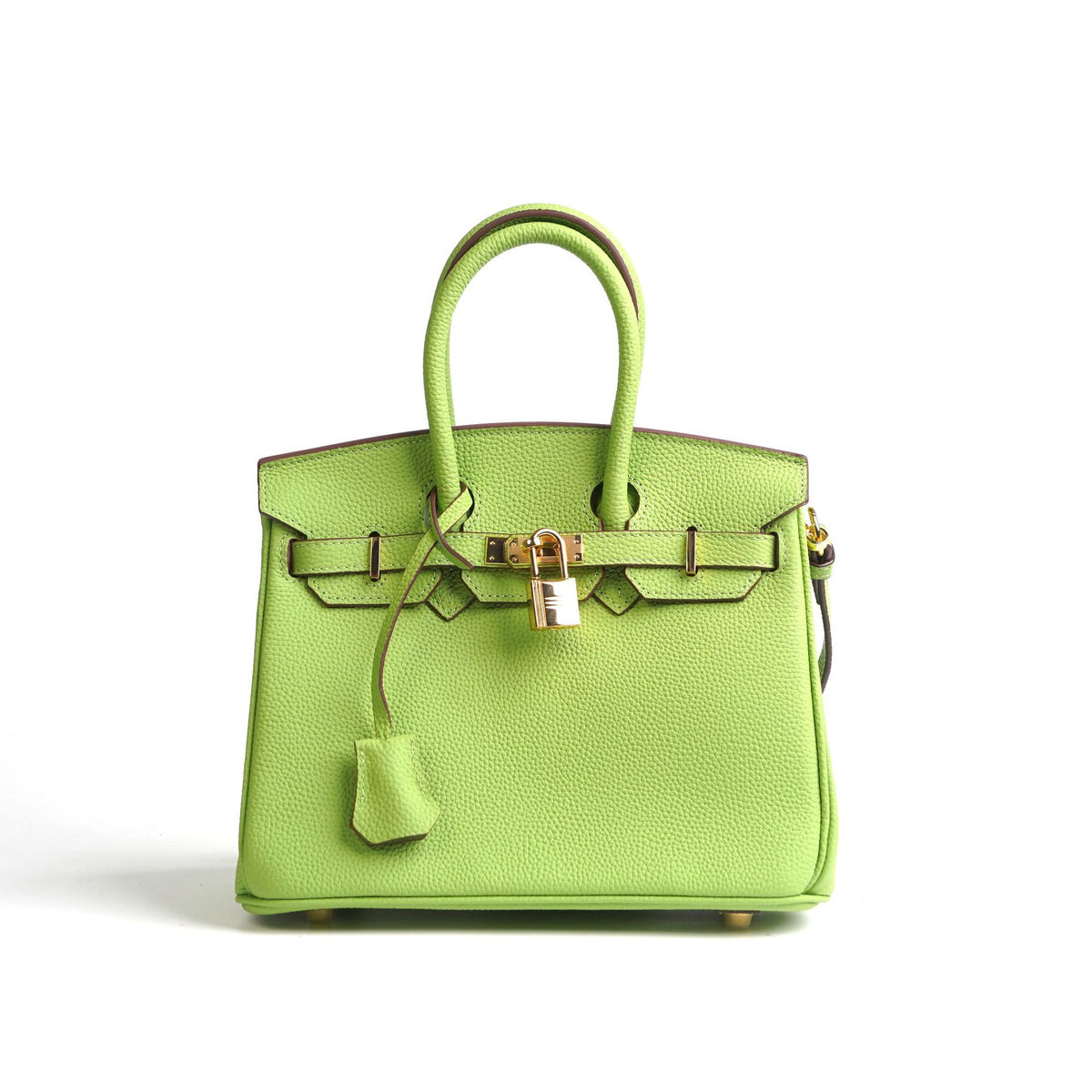 Green handbag with gold hardware on a white background