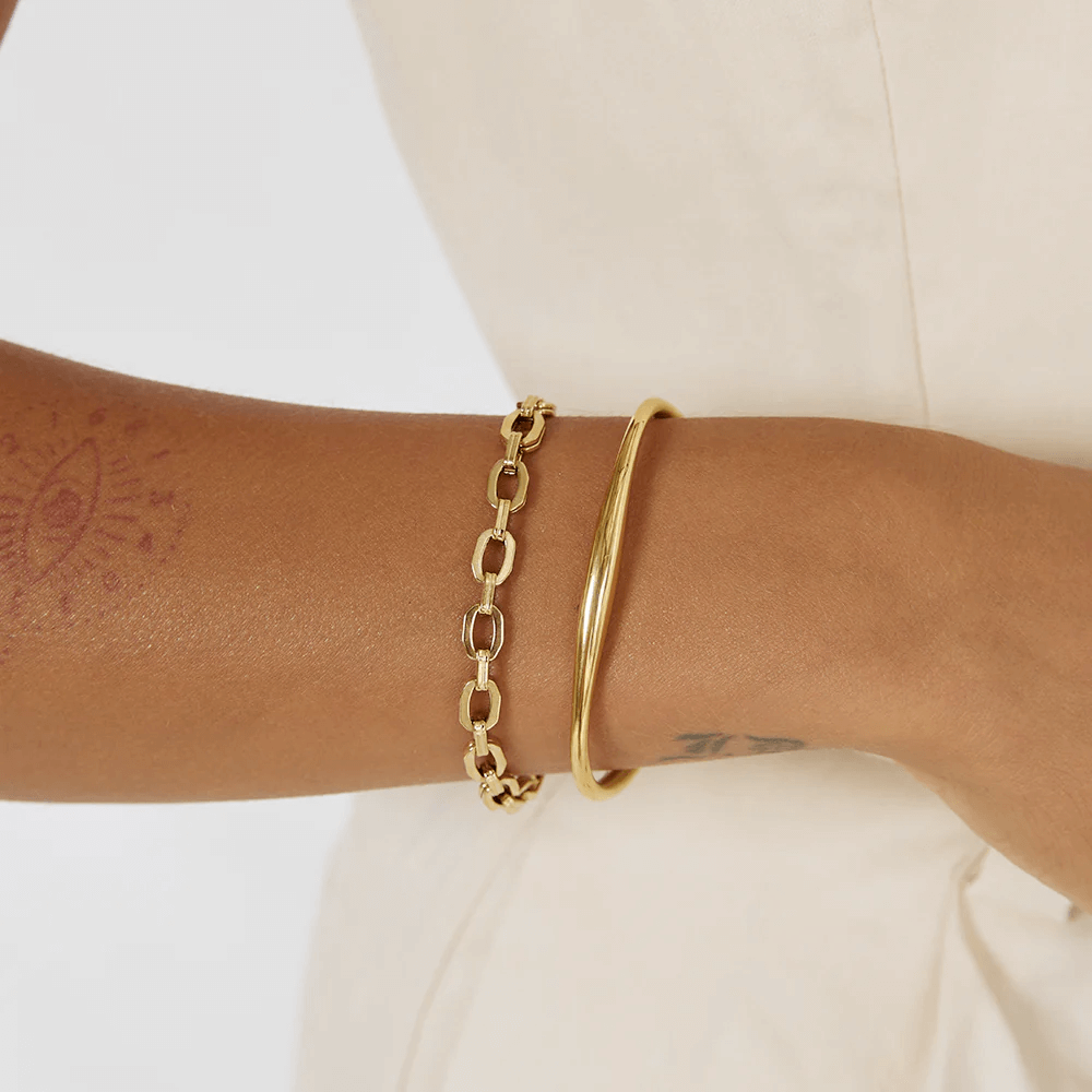 Model wearing Gold cuff bracelet stack