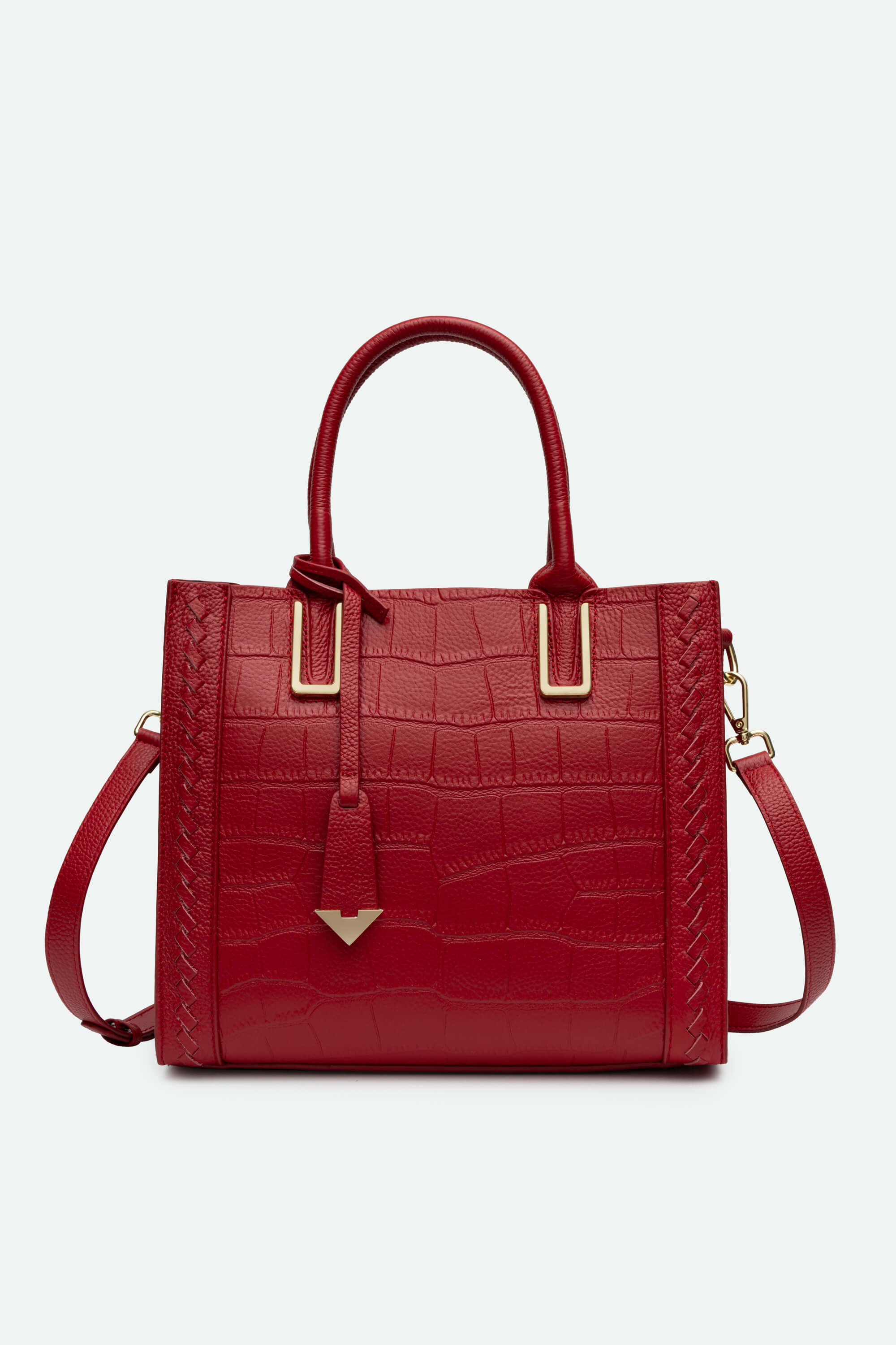 Red handbag with gold accents on a white background