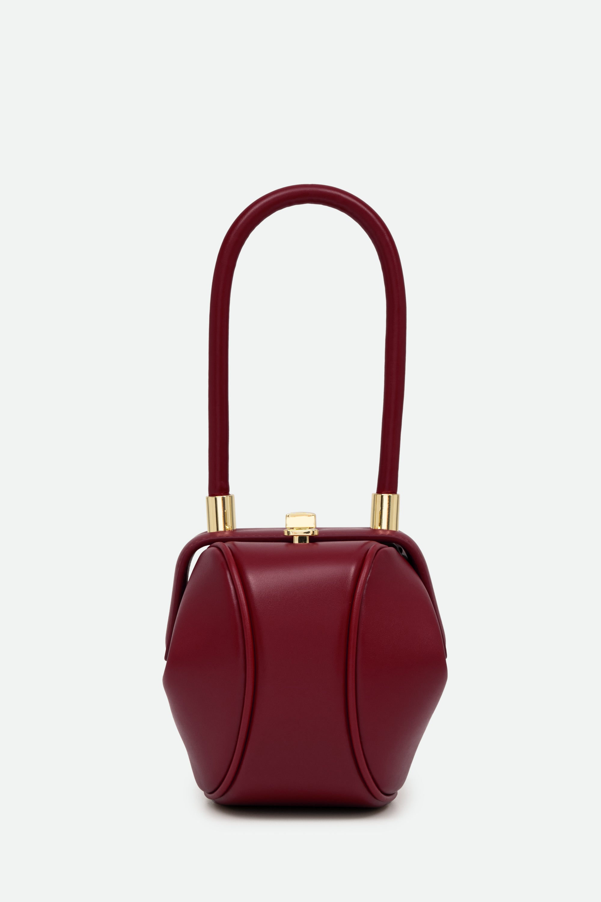 Red handbag with gold accents on a white background