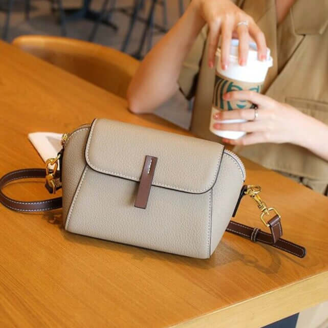 A grey mini crossbody bag