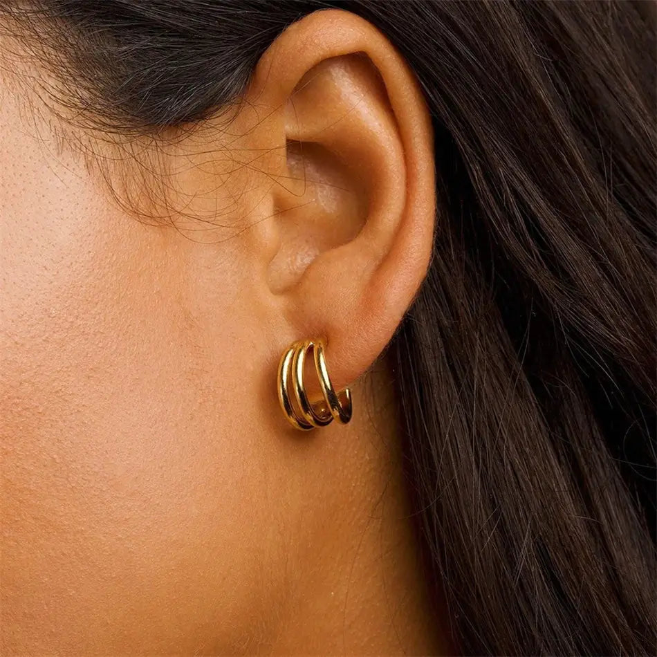 Model wearing Triple Gold Hoop Earrings