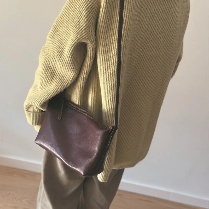 Valentina Seta crossbody bag in Terracotta, worn