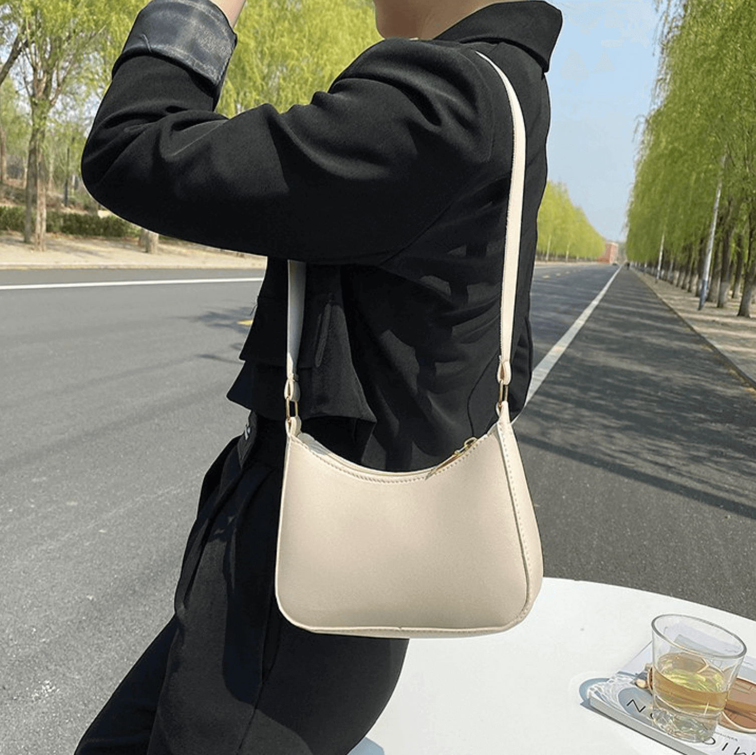 Woman carrying White leather shoulder bag