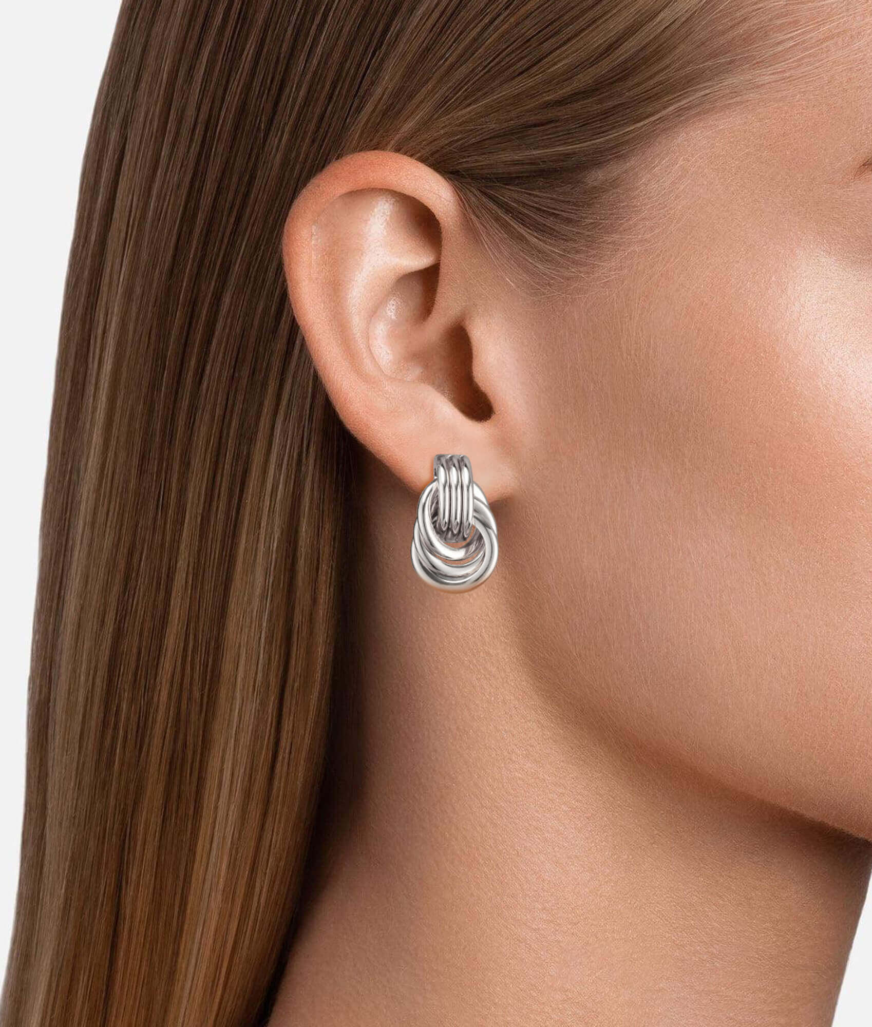 Model wearing Triple Knot Earrings white gold